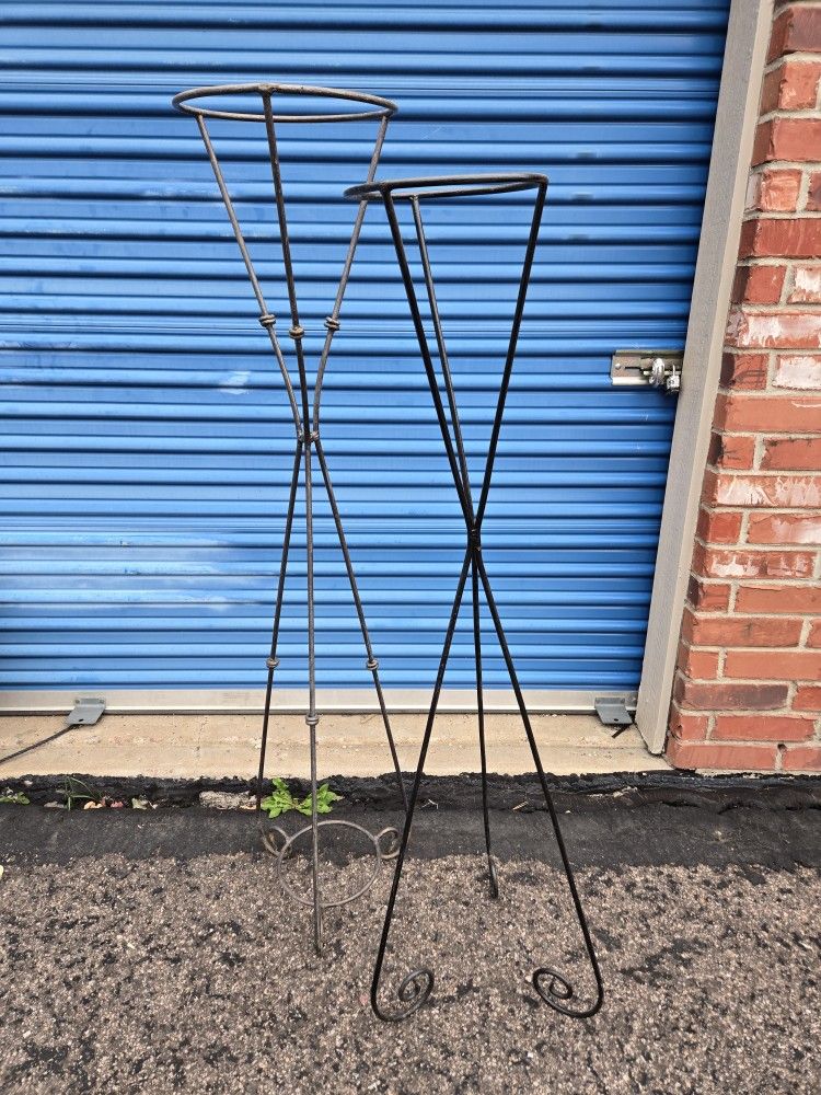 2 Large Tall Metal Stands 54" & 58" tall Good Condition A variety of unique uses