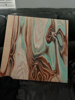 Art work on wood panel surface