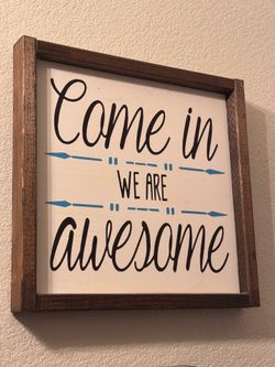 “Come in we are awesome” wooden sign