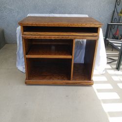 Solid Oak Computer Desk. 23 1/2" Wide, 19" Deep, 31"Tall. Nice Condition. Has Wheels Rolls Good.