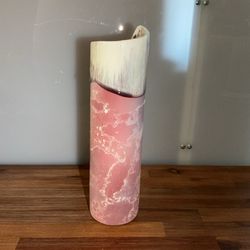 It serves as a centerpiece in living rooms, dining rooms, or hallways, adding texture and color to the décor.