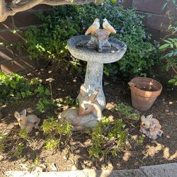Vintage bird bath and cement deer statues
