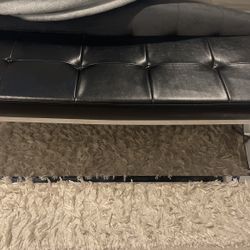 Black Cushion Seat Infront Of Bed 