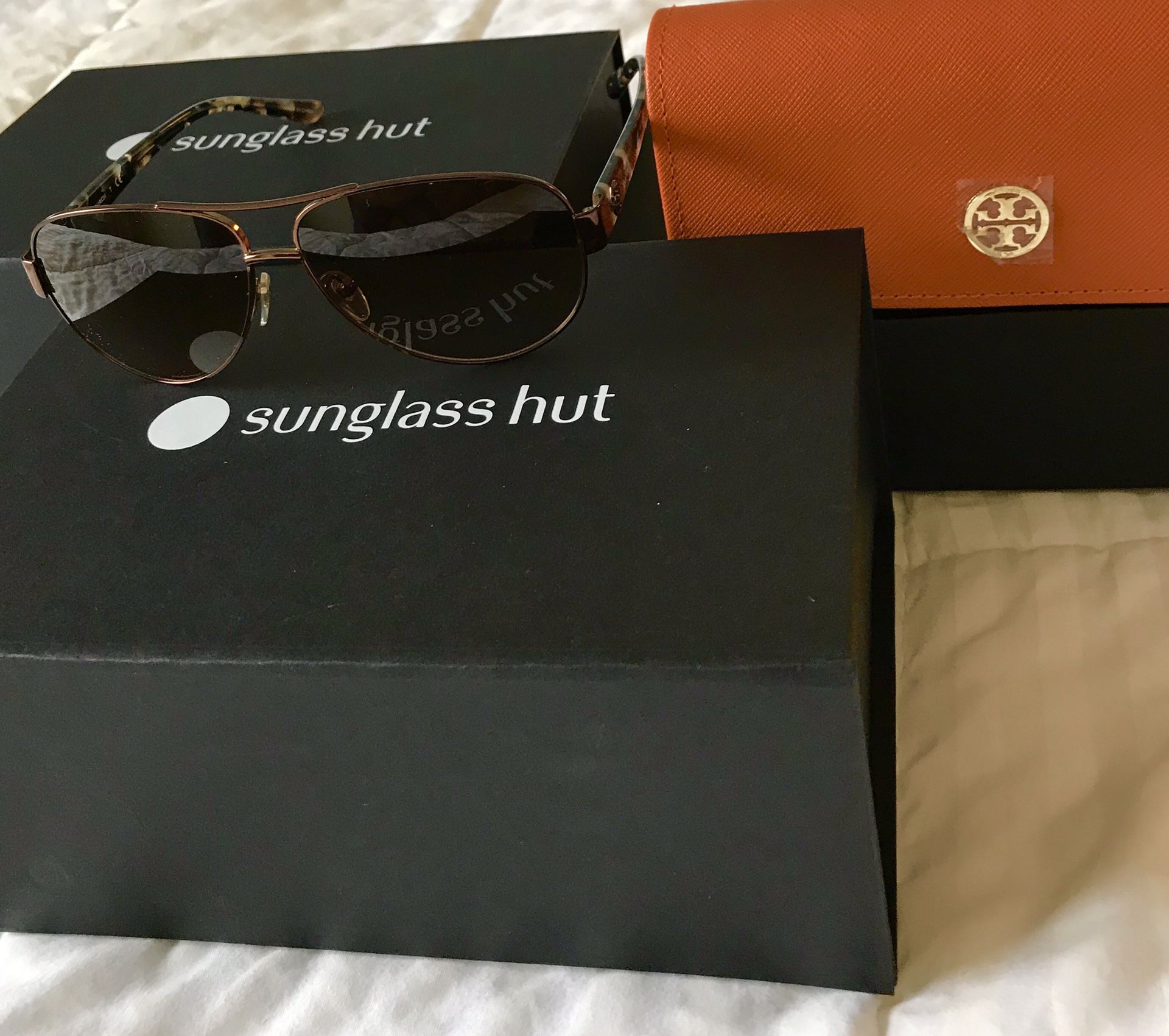 5 Name brand sunglasses brand new with box from sunglass hut $150 each