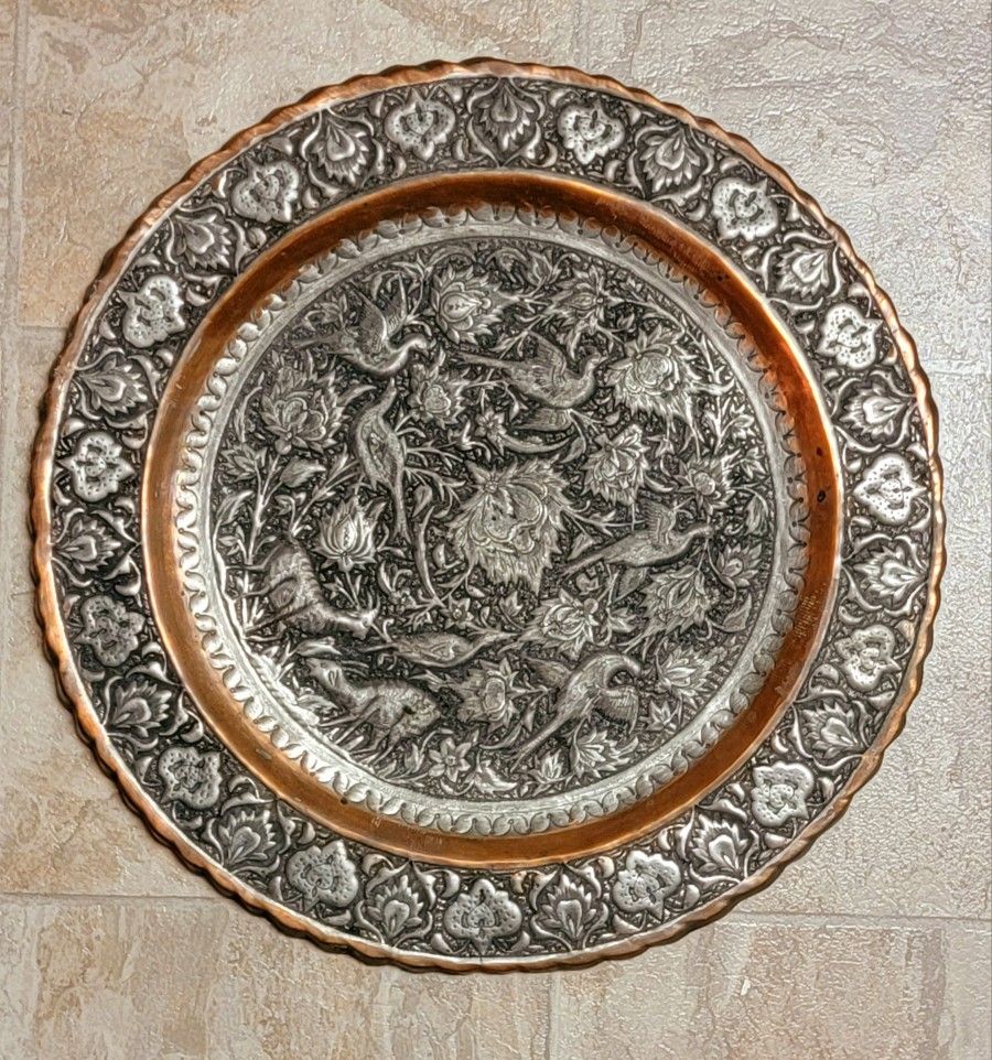 Antique Persian copper plate w/Copper with silver, pewter or tin overlay, likely dating back to the Qajar period.
Material: Copper with silver, pewter