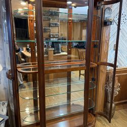 Pulaski Lighted Curved Curio Cabinet with Mirrored Back