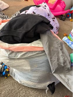 Bag full of men’s clothes.