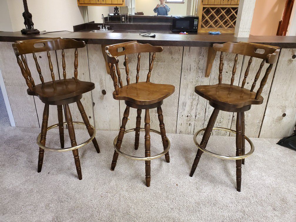 Three solid wood bar stools