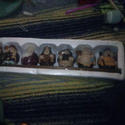 A Set Of Seven Buddha Type Figurines 