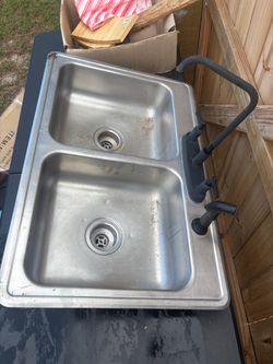 Stainless steel double sink with faucet