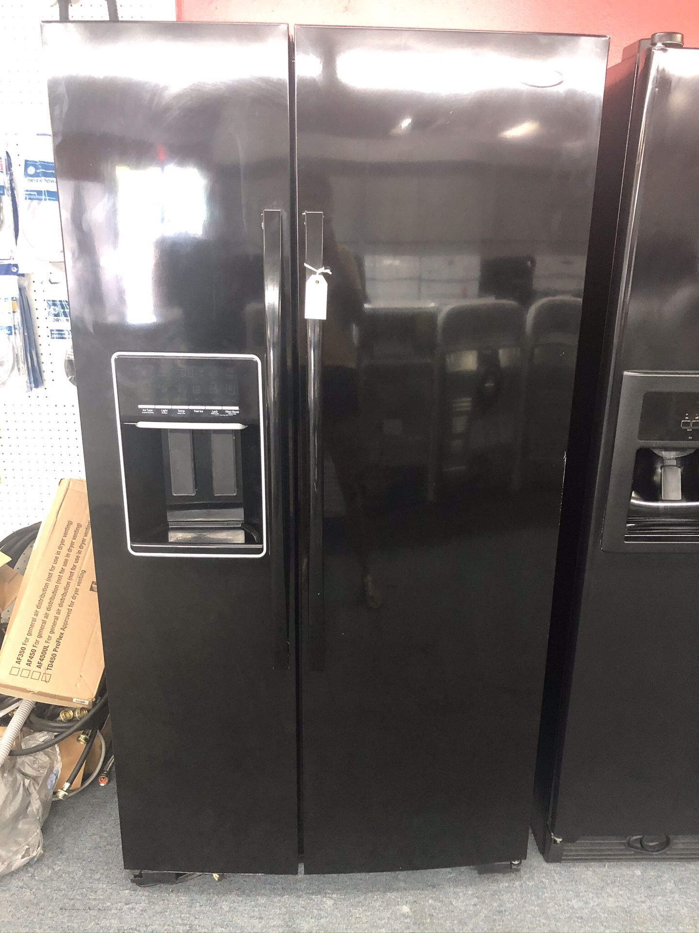 Used whirlpool 26 cu ft side by side fridge. 1 year warranty