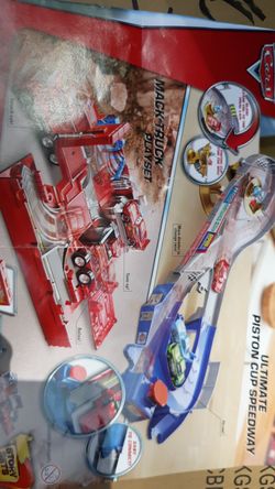 Disney Pixar Cars Mack truck playset two sets in one ultimate Piston Cup Speedway and the truck new in box