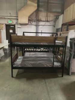 Twin bunk bed. Available in espresso. Bunk bed only-$220. With mattresses-$399. Assembly required. Assembly not included. Tax included. Free delivery.