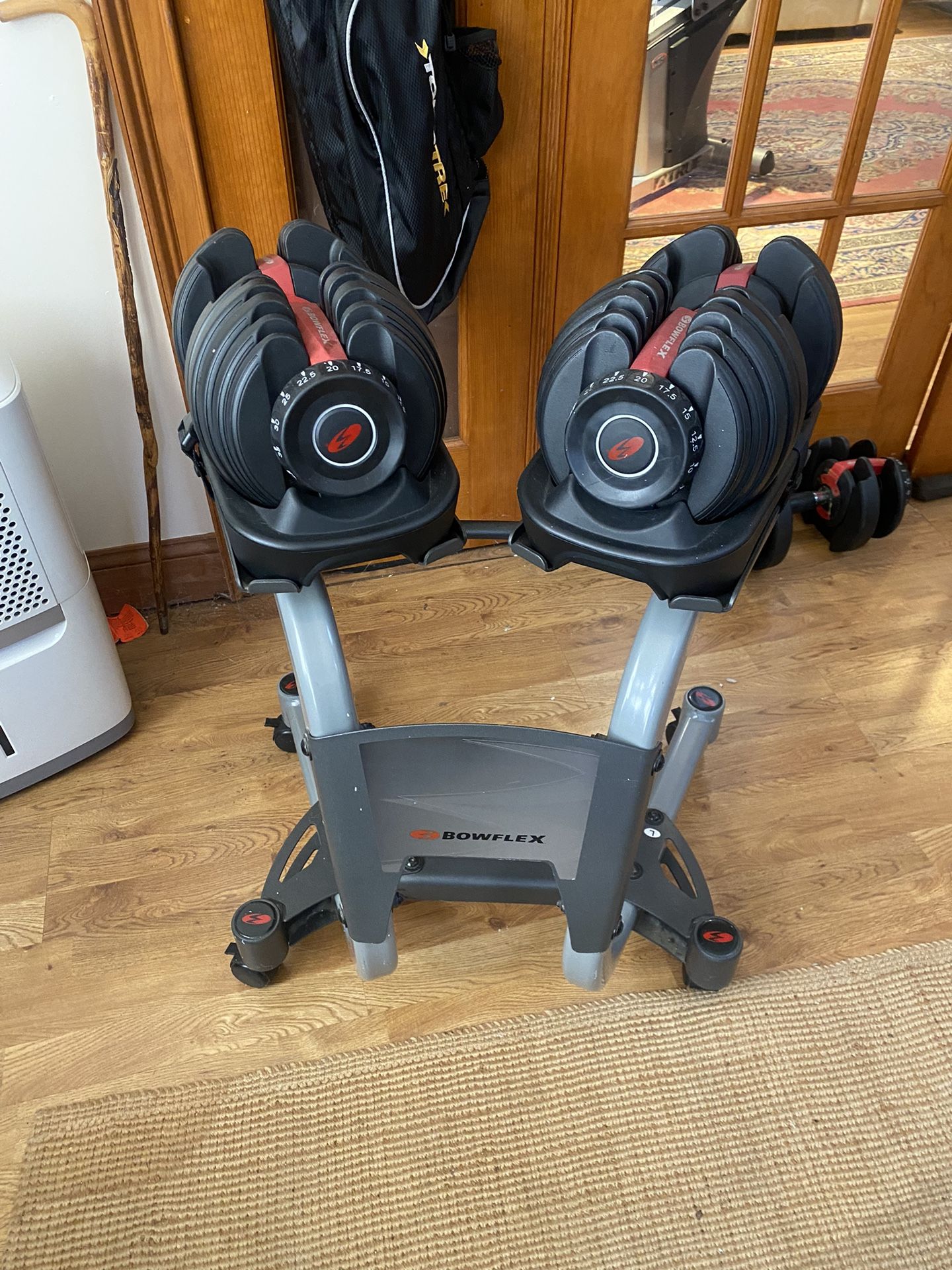Pair Of Genuine Bowflex 52.5 Lbs Dumbbells With Wheeled Stand