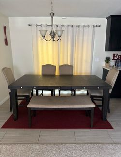 Wood dinner table with 4 chairs and bench