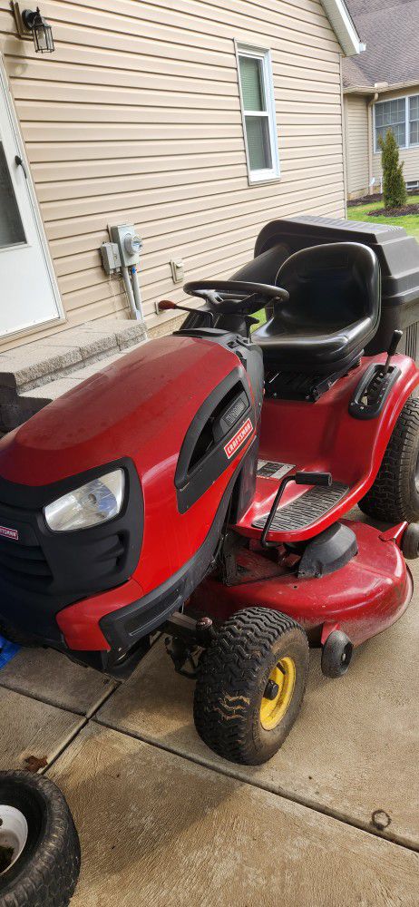 Craftsman forty six inch deck riding lawn mower... With grass catcher.