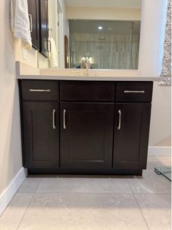 2 - 42” bathroom vanities with quartz countertops and matching medicine cabinets