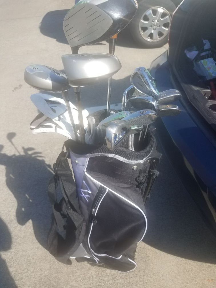 Golf clubs, gloves, and bag