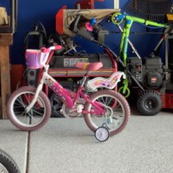 Titan Girls BMX bike with training wheels and doll basket and more. From Walmart, 16” tire model  Plainfield, Illinois