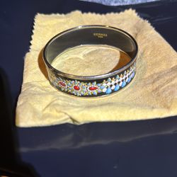 Hermes enamel flowers bangle bracelet in excellent condition