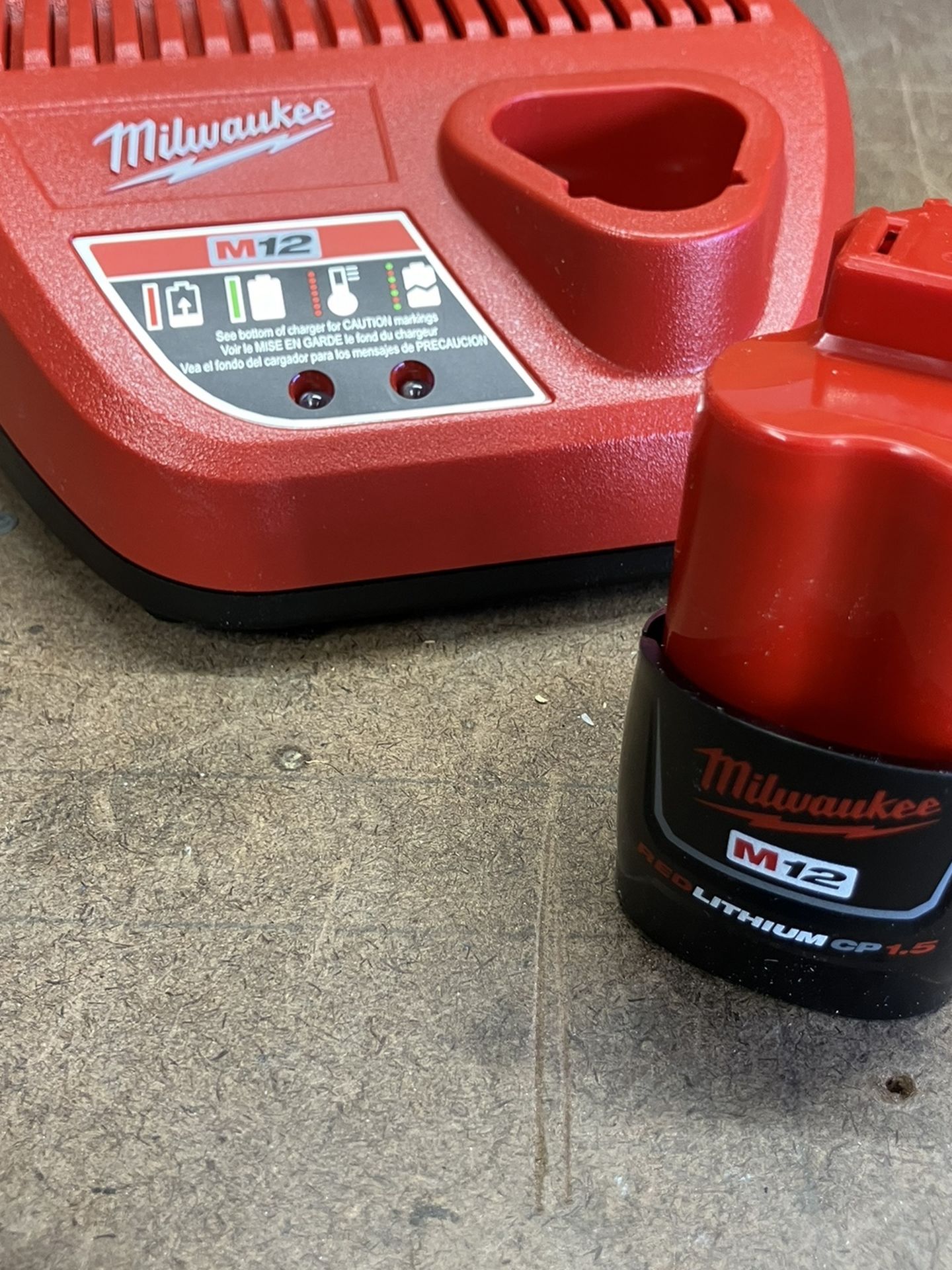 BRAND NEW M12 CHARGER AND BATTERY 