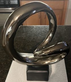 modern abstract ceramic sculpture with a metallic "chrome" or electroplated finish southern highlands area vegas