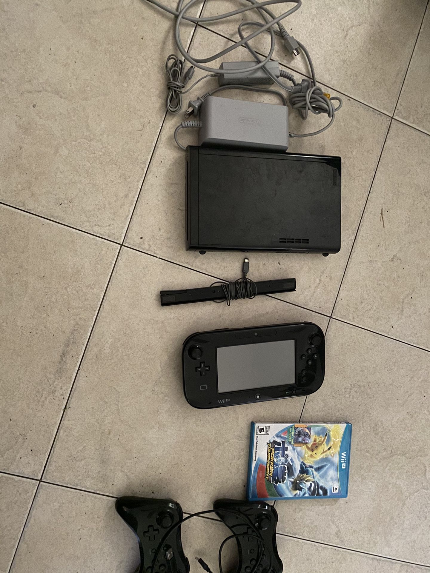 Nintendo Wii U system in good condition with two extra controllers and as game
