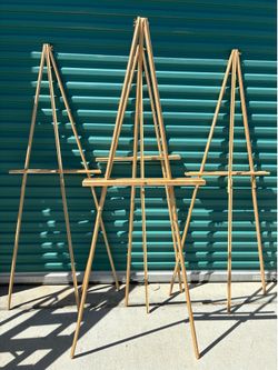 Three wooden artist display easels