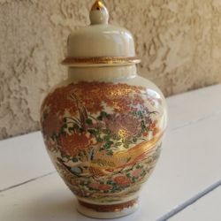  Gorgeous vintage Japanese Satsuma vase urn with lid. Crazing glazed. The artwork, with gold gilding, of peacocks, cherry bloss  8in Tall X 5.5in Wide