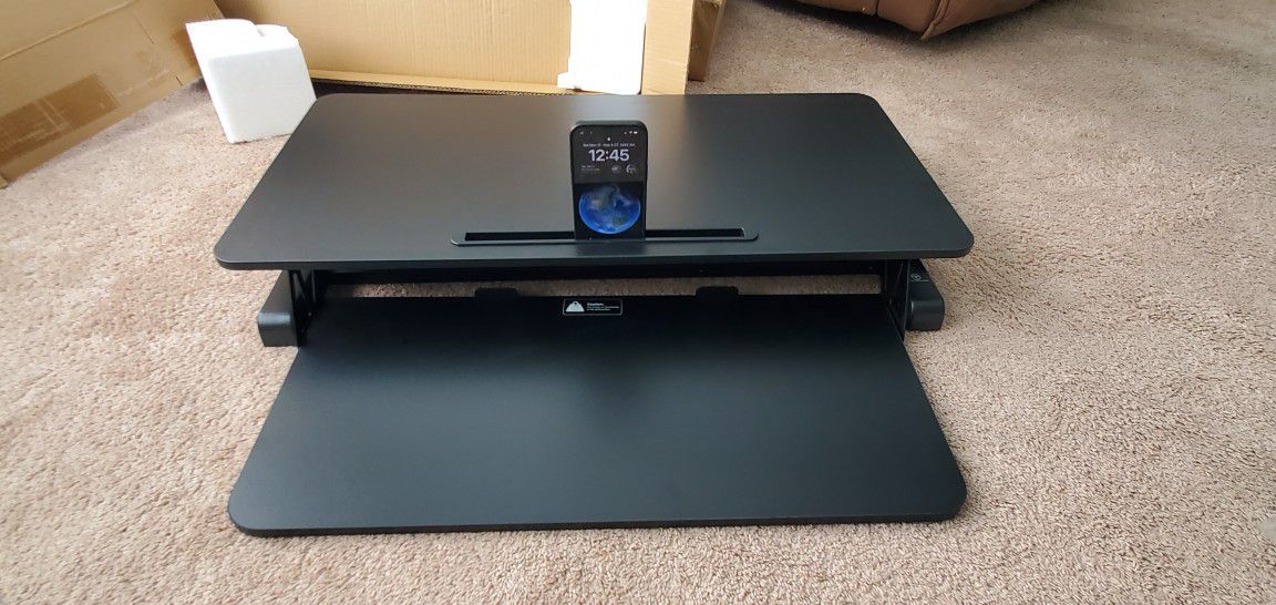 Brand New TechOrbits sit-stand desk converter with gas spring lift for easy switching between sitting and standing.  Hreight adjustable