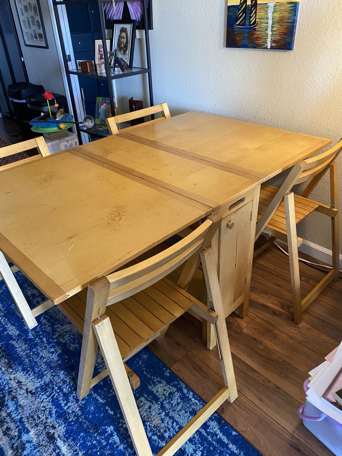 IKEA stowaway dining table 4 chairs. Can seat six