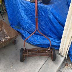 Vintage Wheel Barrow And Old School Push Lawn Mower