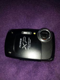 Fuji. Take video. And photos ..14 megapixls.. water dust. And freeze proof.. .
