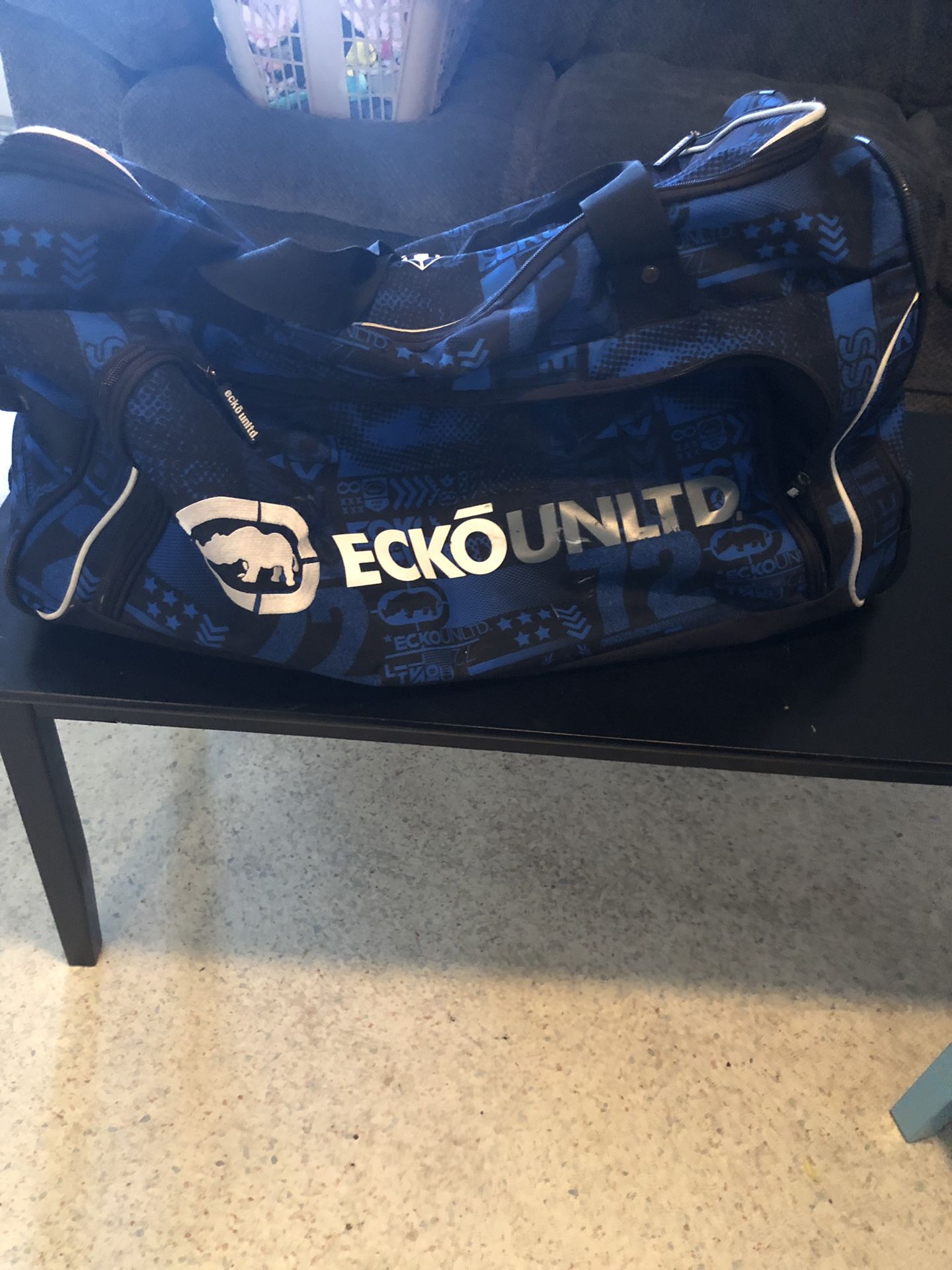 Ecko rolling duffle bag with wheels and handle