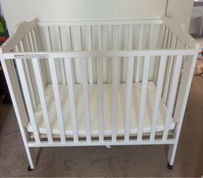 Delta White Mini Baby Crib with Mattress