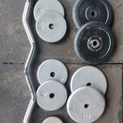 Standard size weight plates and curl bar 