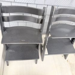 Two Black Stokke Tripp Trapp Chairs