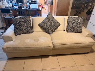 Beige Couch with Throw Pillows