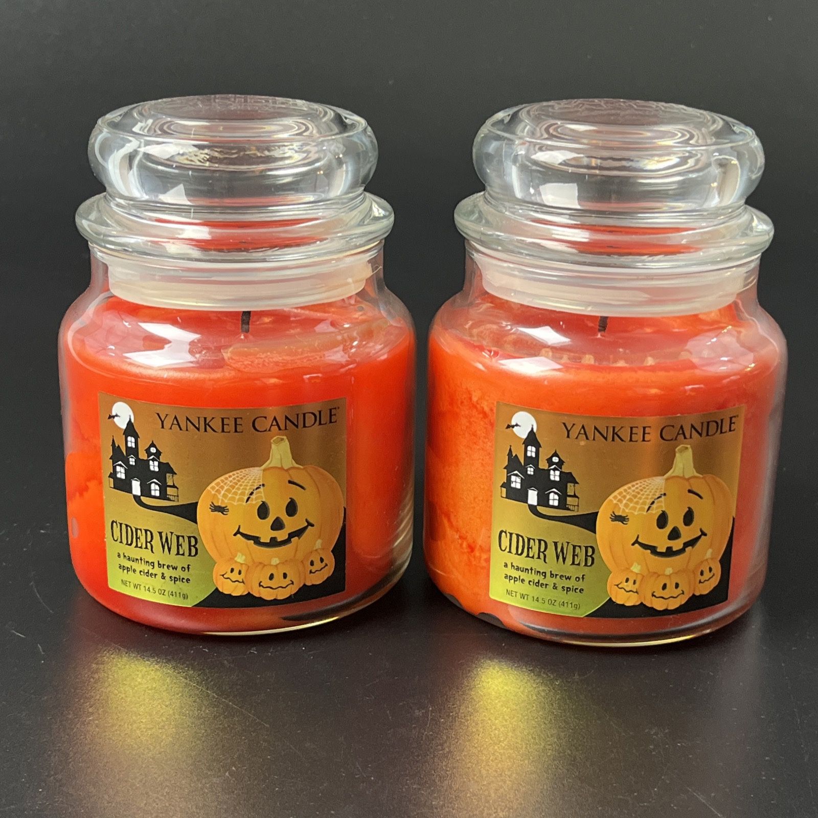  2 Yankee Candle Halloween Cider Web Haunted House Retired 14.5oz Apple Spice Lot  Very Little use, as you can see by the pictures.  Selling as is as 