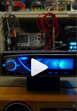 Panasonic stereo from 2000s vintage (dolphins and race car displays on screen)