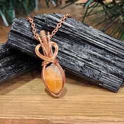 Orange Calcite Gemstone Pendant Wire Wrapped In Copper 