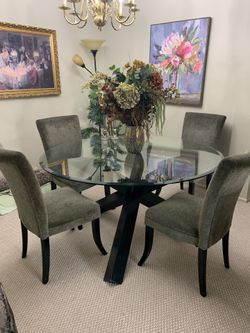 Round glass table with 4 chairs ( items in pictures Not included)