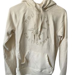 Hollister Ladies Cream Hoodie XS  Bird On Front Pullover   Comes from a pet and smoke free home.  Al measurements are in the pictures. This Hollister 