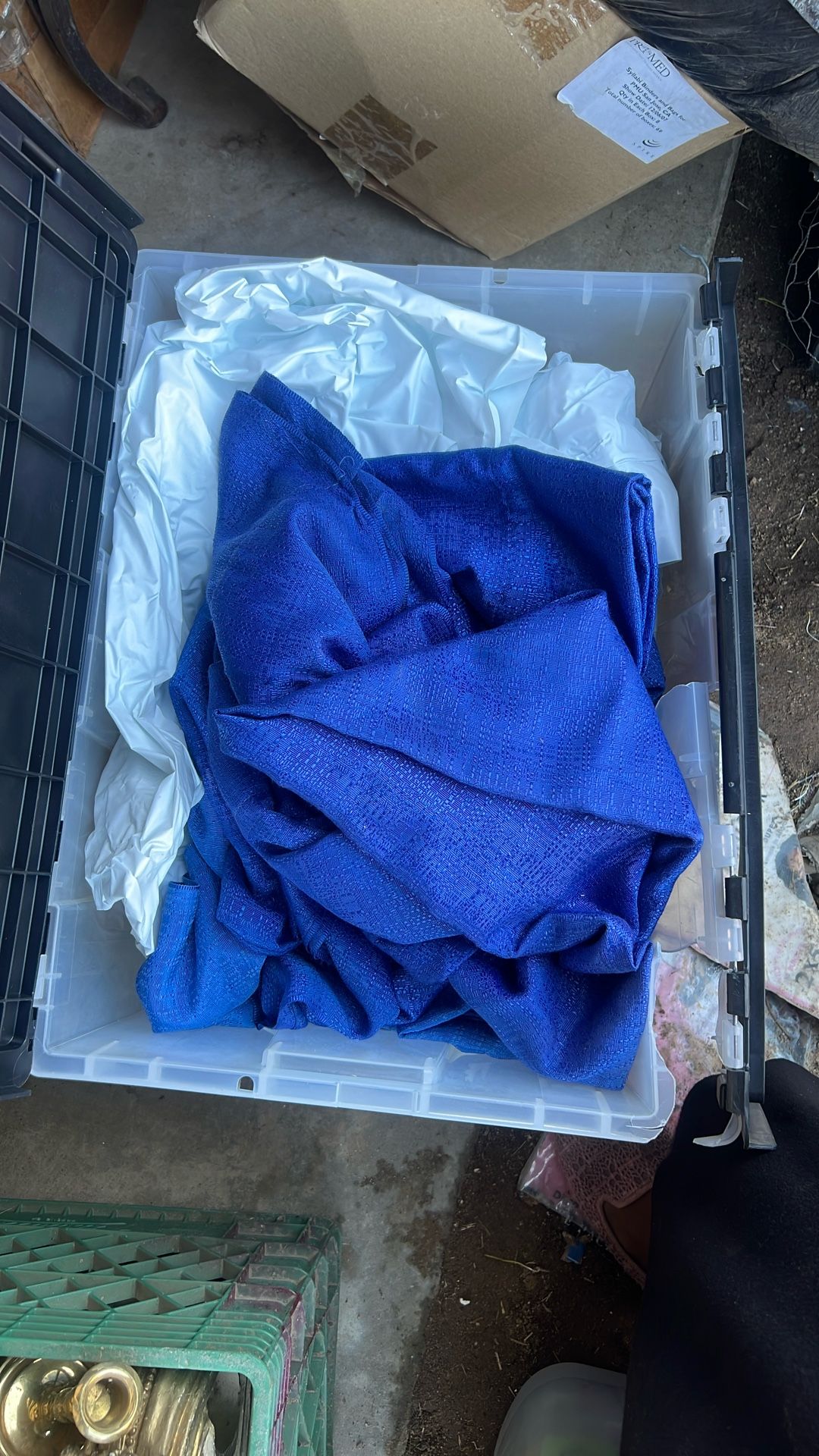Box Of Plastic Linen, And Blue Tablecloth