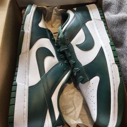 Green and white Nike Dunk Low trainers