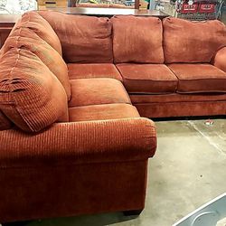 Nice corner sectional couch grouping. Rich burnt orange Color 