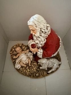 Kneeling Santa Christmas figurine