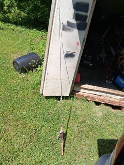 Vintage two piece fiberglass rod with a daiwa 403a fishing reel
