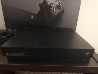 Xbox One X with red controller