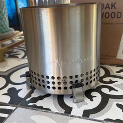 Solo Stove with box of wood